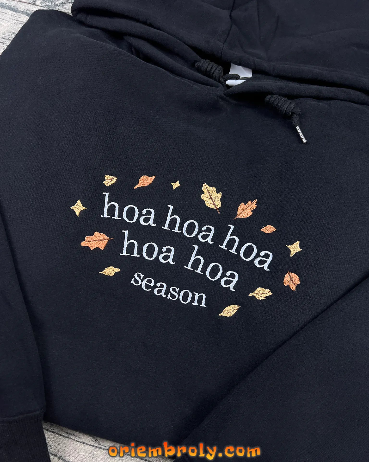 Black hoodie with autumn leaves embroidery inspired by Forks WA