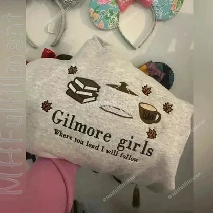 White towel with 'Gilmore girls Where you lead I will follow' text and coffee-themed graphics on a white background.