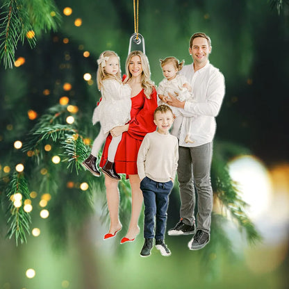 Custom photo Christmas tree decoration with a happy family portrait.