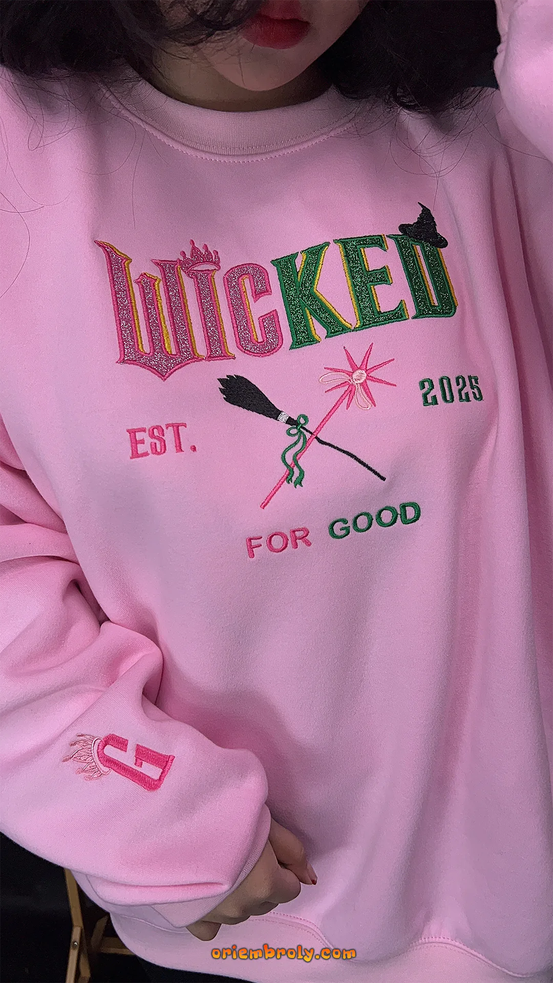 Stitched Wicked design sweatshirt for theater fans