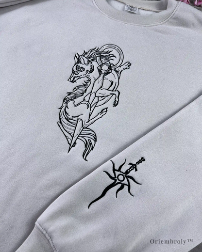 Fantasy inspired wolf embroidered crewneck flat lay