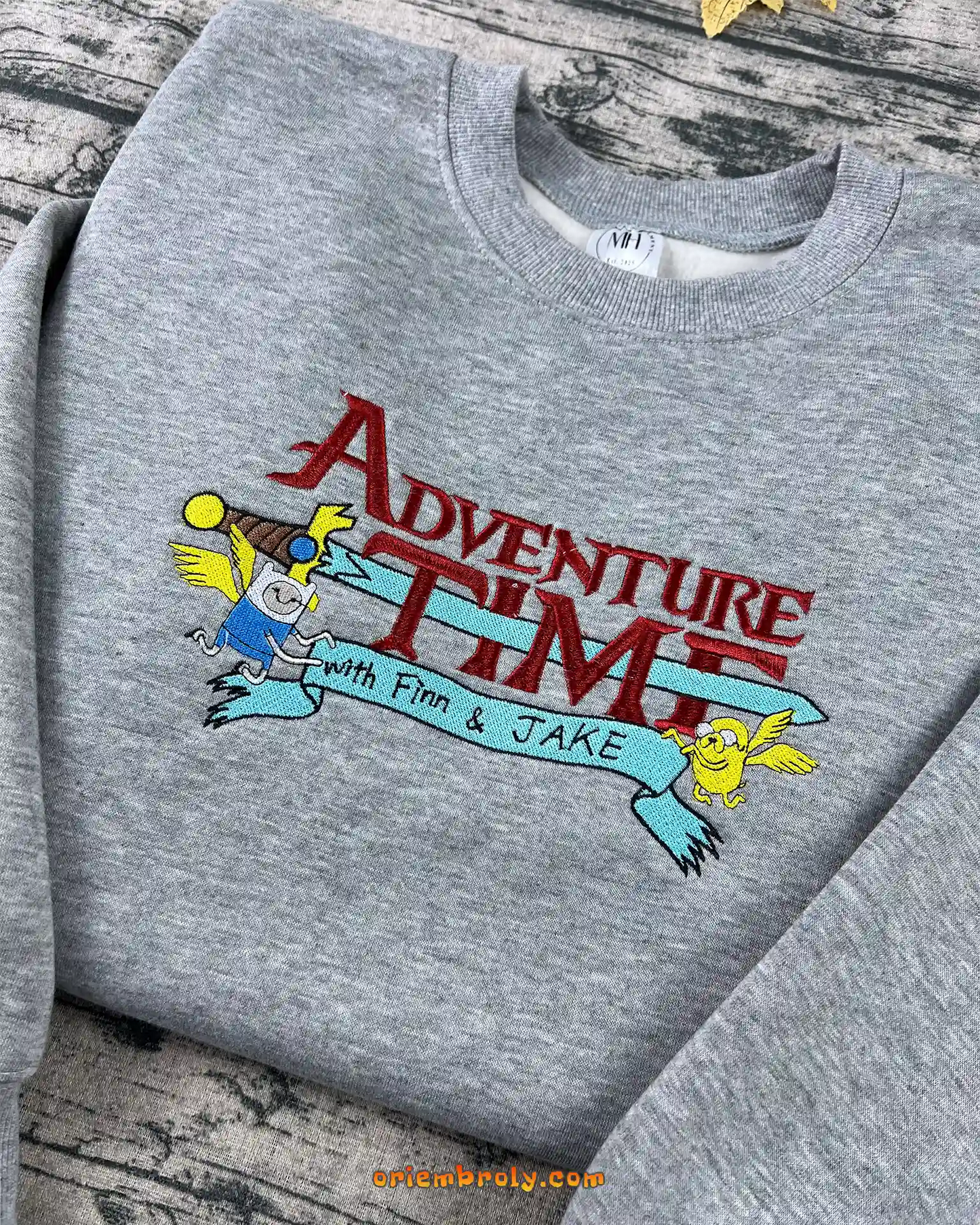 Textured embroidered Finn and Jake design on crewneck