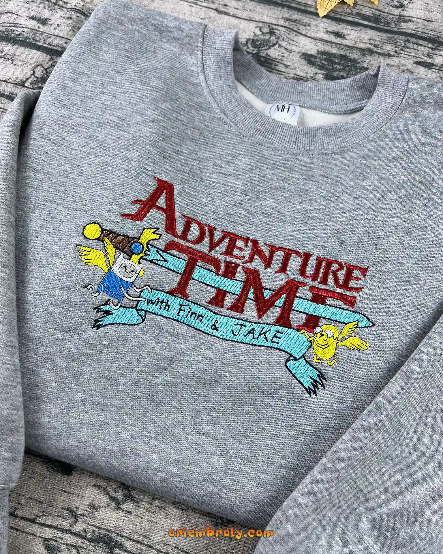 Textured embroidered Finn and Jake design on crewneck