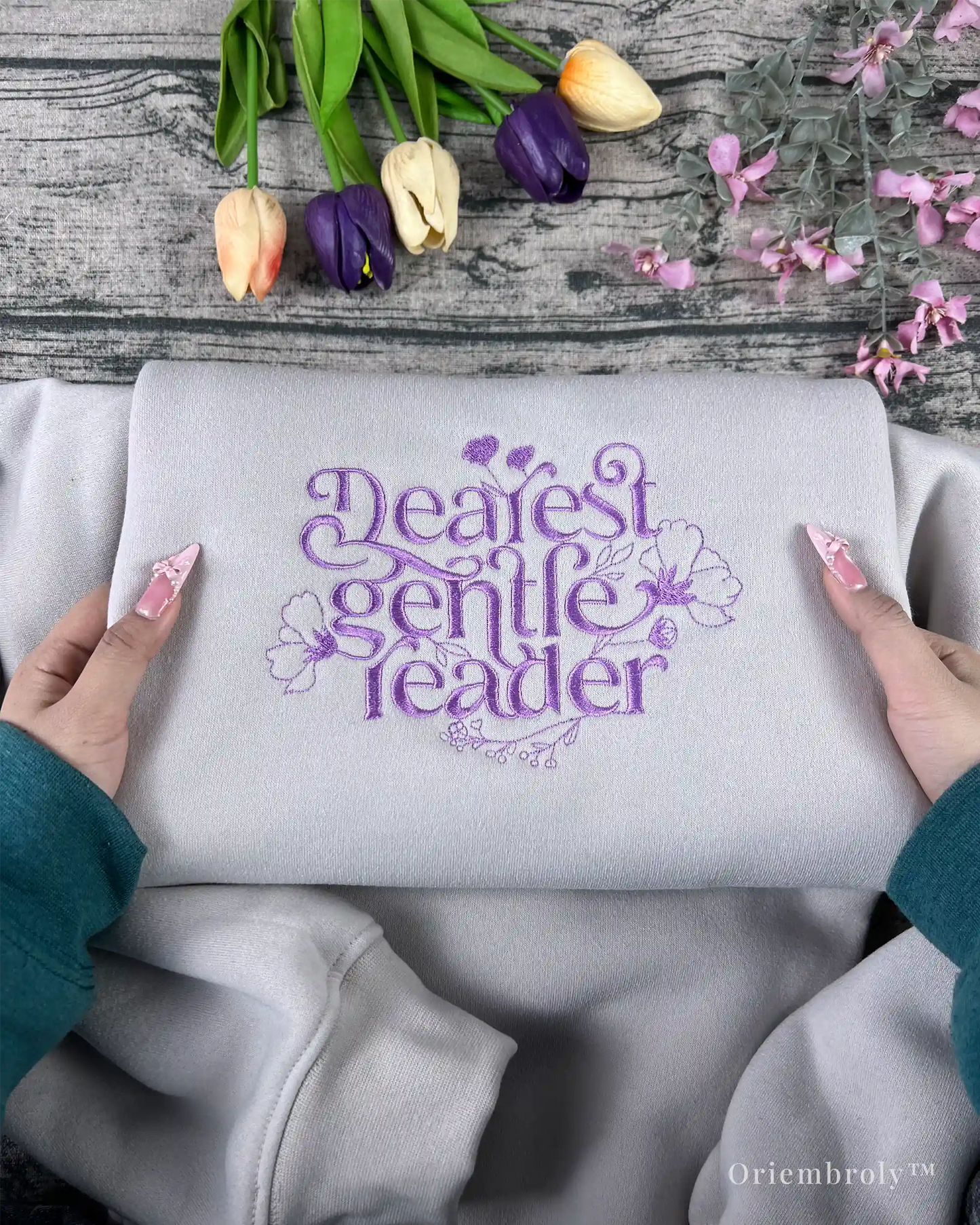 floral script embroidery detail on crewneck sweatshirt