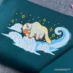 close up embroidery of flying sky bison with textured stitching