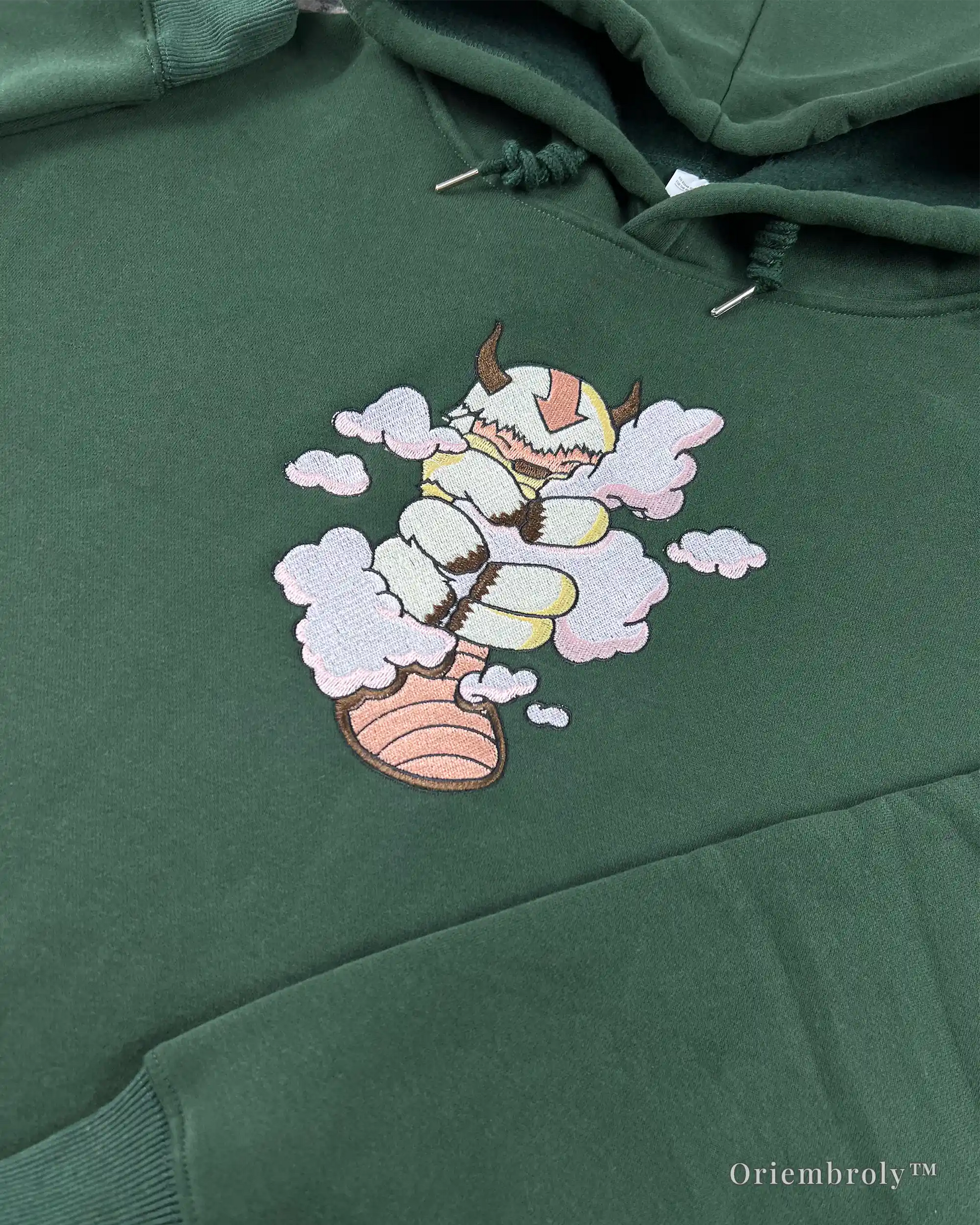 forest green embroidered fantasy hoodie flat lay