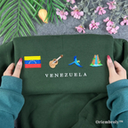 forest green Venezuela embroidered crewneck flat lay