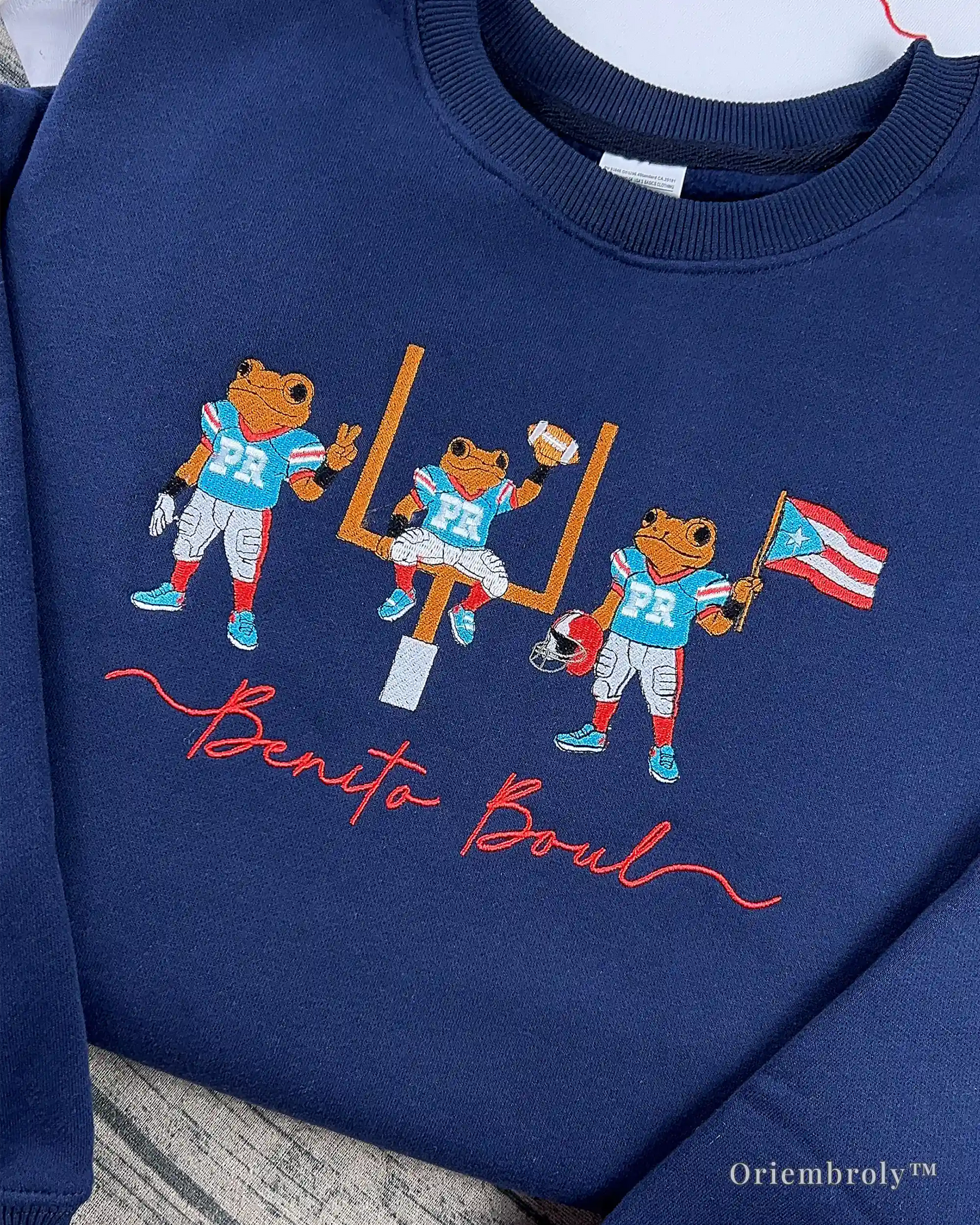 frog football embroidery detail on embroidered sweatshirt