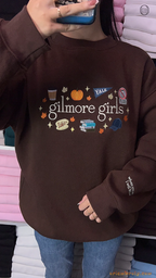 Front view try-on fit of the brown Gilmore Girls embroidered oversized sweatshirt