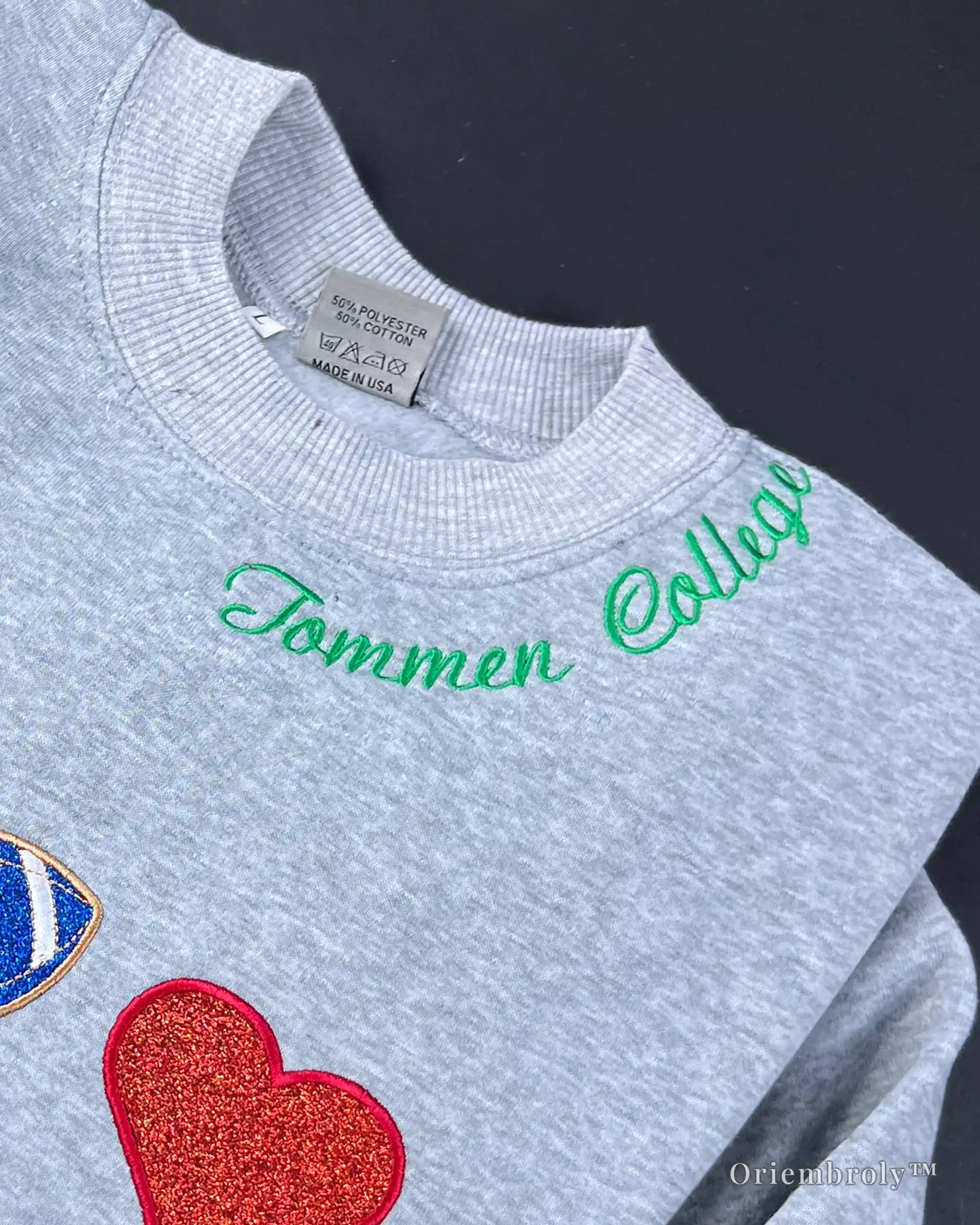 glitter satin stitch embroidery detail on varsity sweatshirt