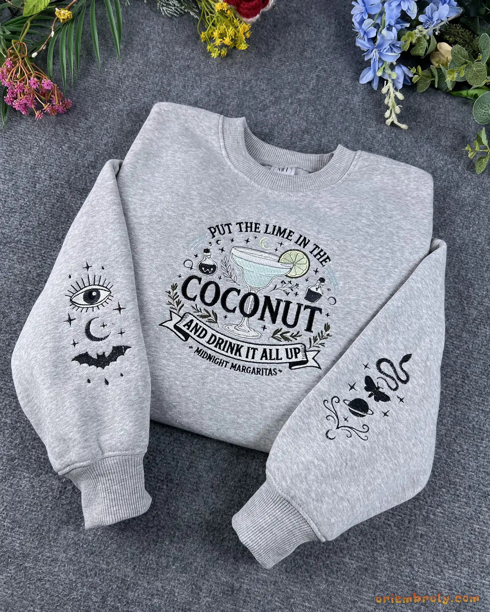 Overview flat lay of grey Practical Magic inspired embroidered crewneck sweater with custom dual sleeve art