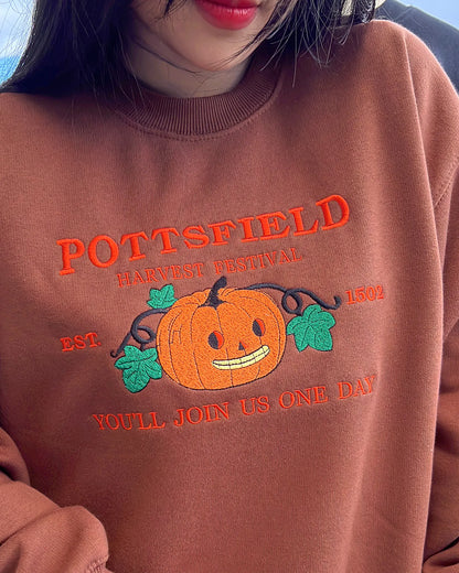 Halloween harvest festival sweatshirt with detailed embroidered pumpkin and skeleton motif