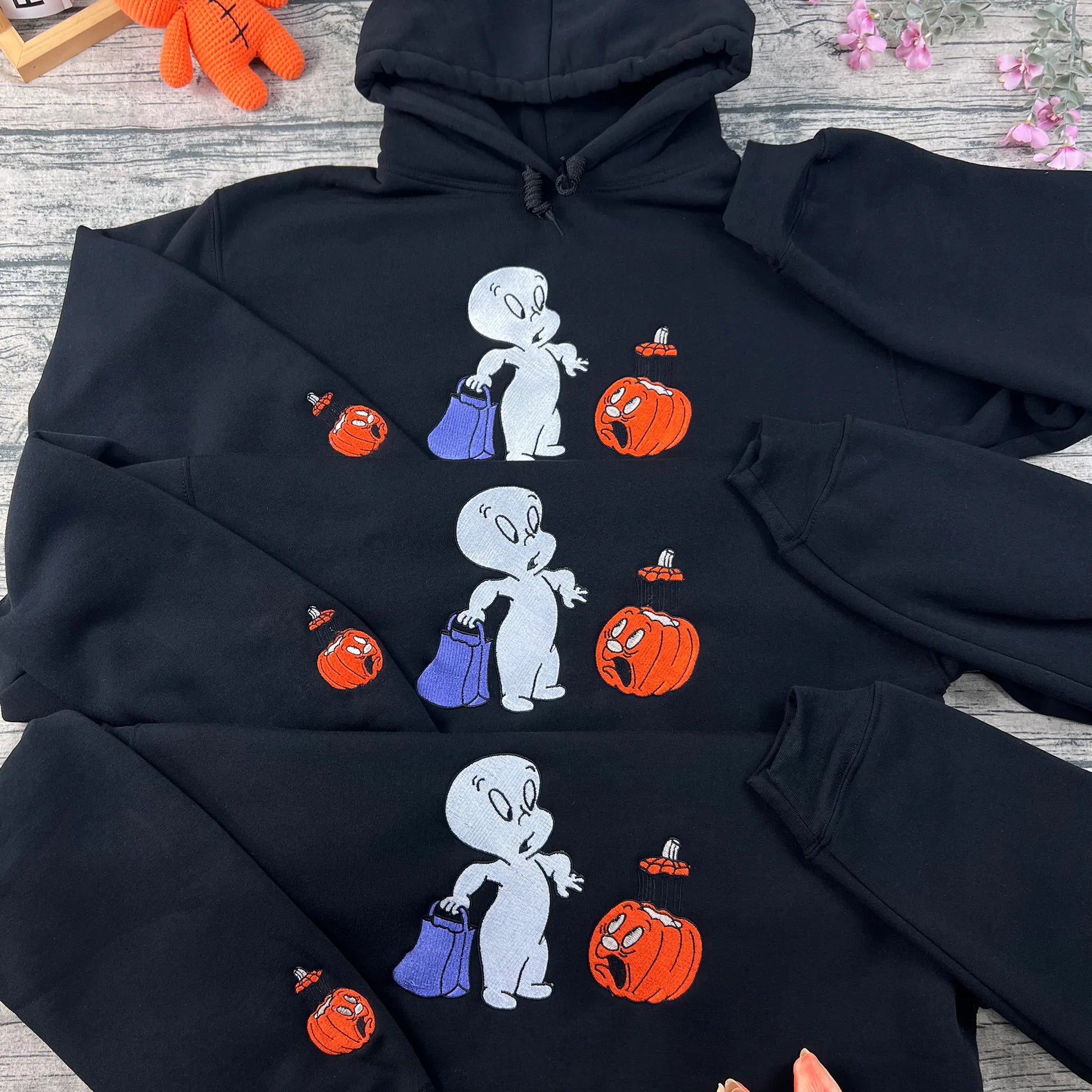 Halloween pumpkin embroidered sweatshirt in cozy orange, perfect for spooky season and autumn outfits.