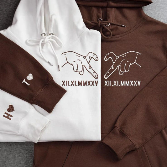 Custom embroidered sweatshirt with hand-drawn Roman numeral design.