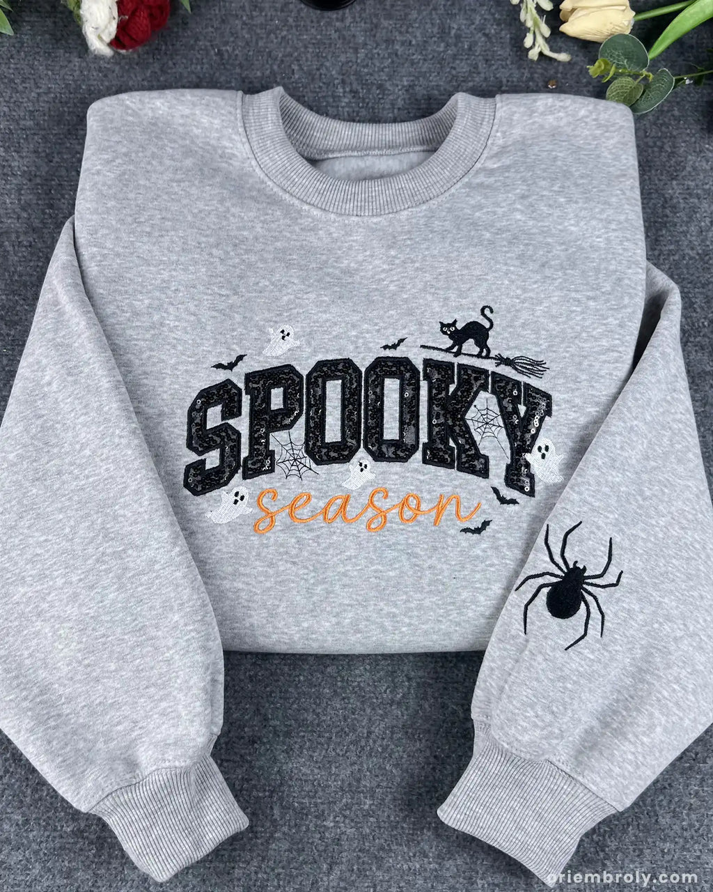 Flatlay presentation of heather grey spooky season sequined embroidered pullover sweatshirt.