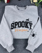 Flatlay presentation of heather grey spooky season sequined embroidered pullover sweatshirt.
