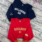 White embroidered hockey name and number crewneck
