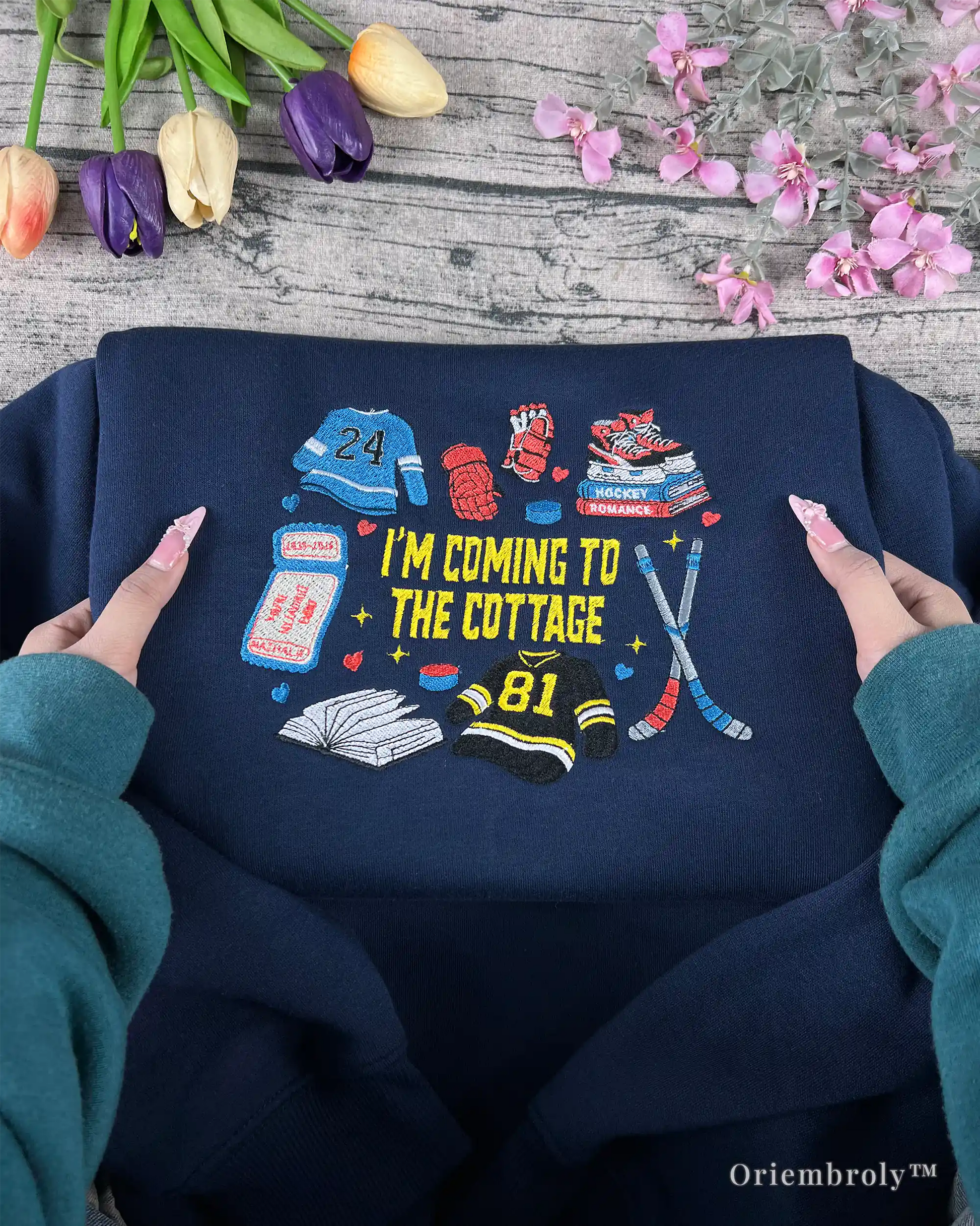 hockey romance inspired embroidered crewneck flat lay
