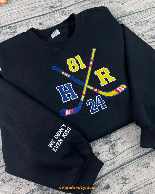 Hockey romance fan sweatshirt with crossed hockey sticks embroidery