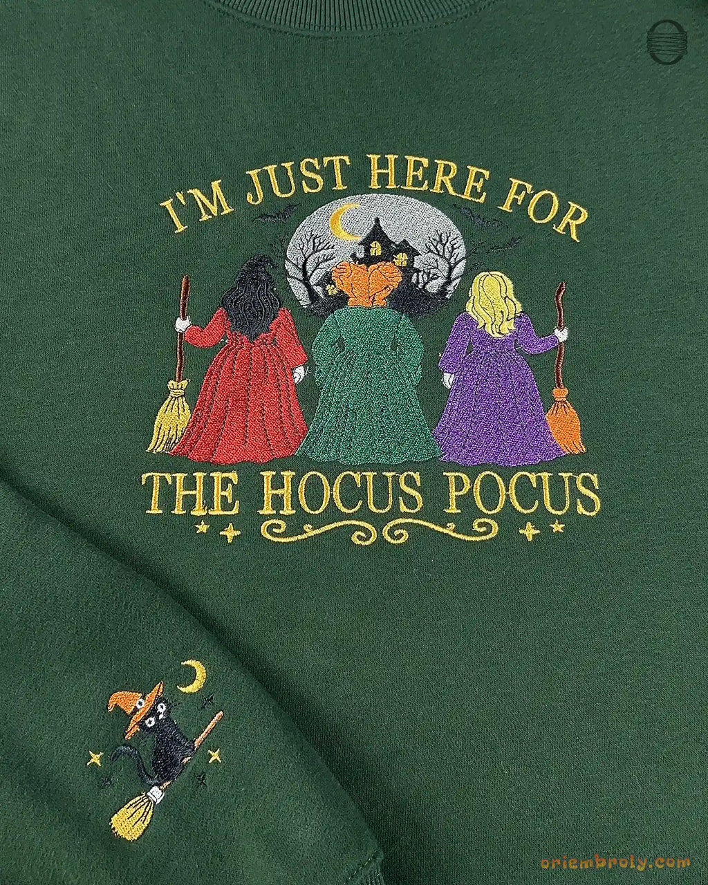 Forest green Hocus Pocus embroidered sweatshirt showing both the main chest graphic and black cat sleeve detail