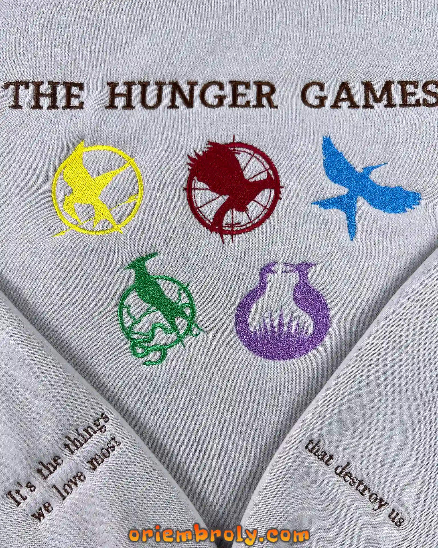 Close-up of symbolic embroidery inspired by Hunger Games