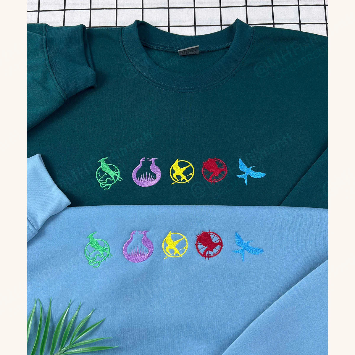 Mockingjay symbol embroidery on crewneck