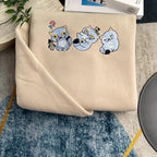 Beige fabric with cartoon cat designs on a textured surface