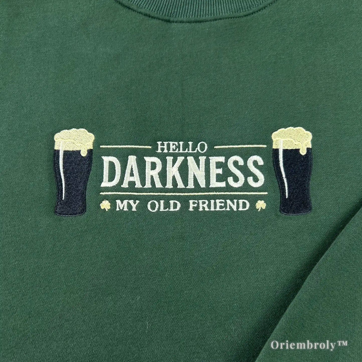 detailed embroidery of dark stout beer pint with foam