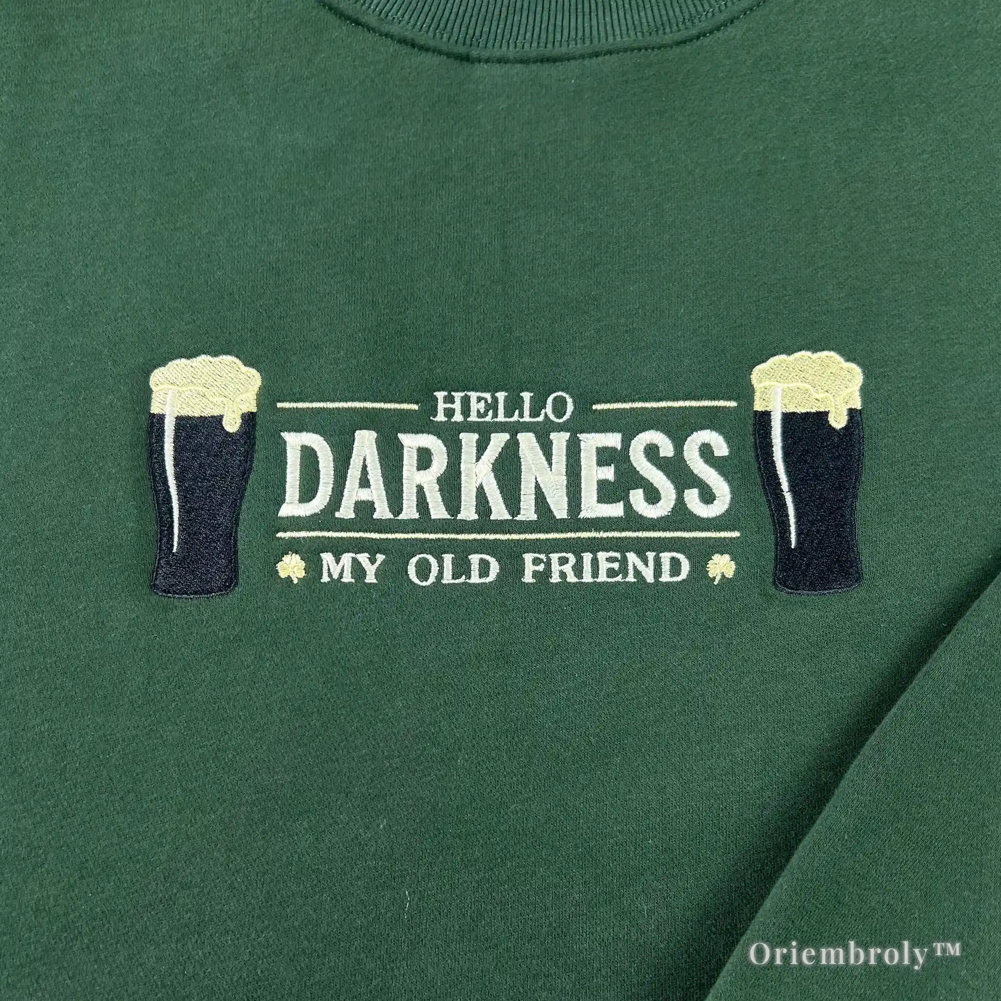 detailed embroidery of dark stout beer pint with foam