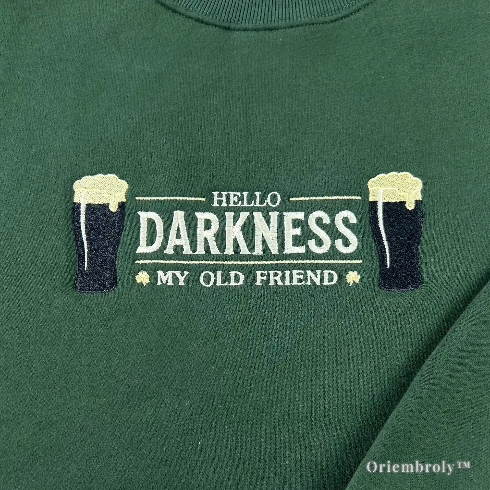 detailed embroidery of dark stout beer pint with foam