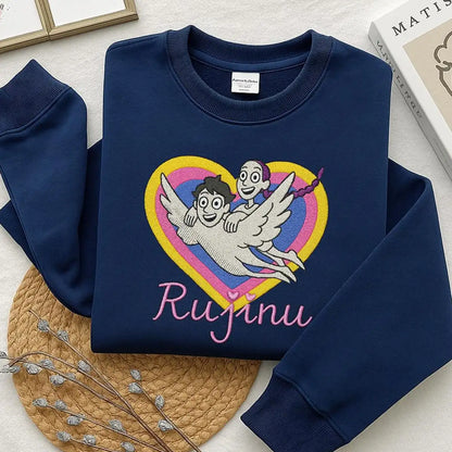 Navy blue sweatshirt with a heart design and 'Rujinu' text on a light surface.