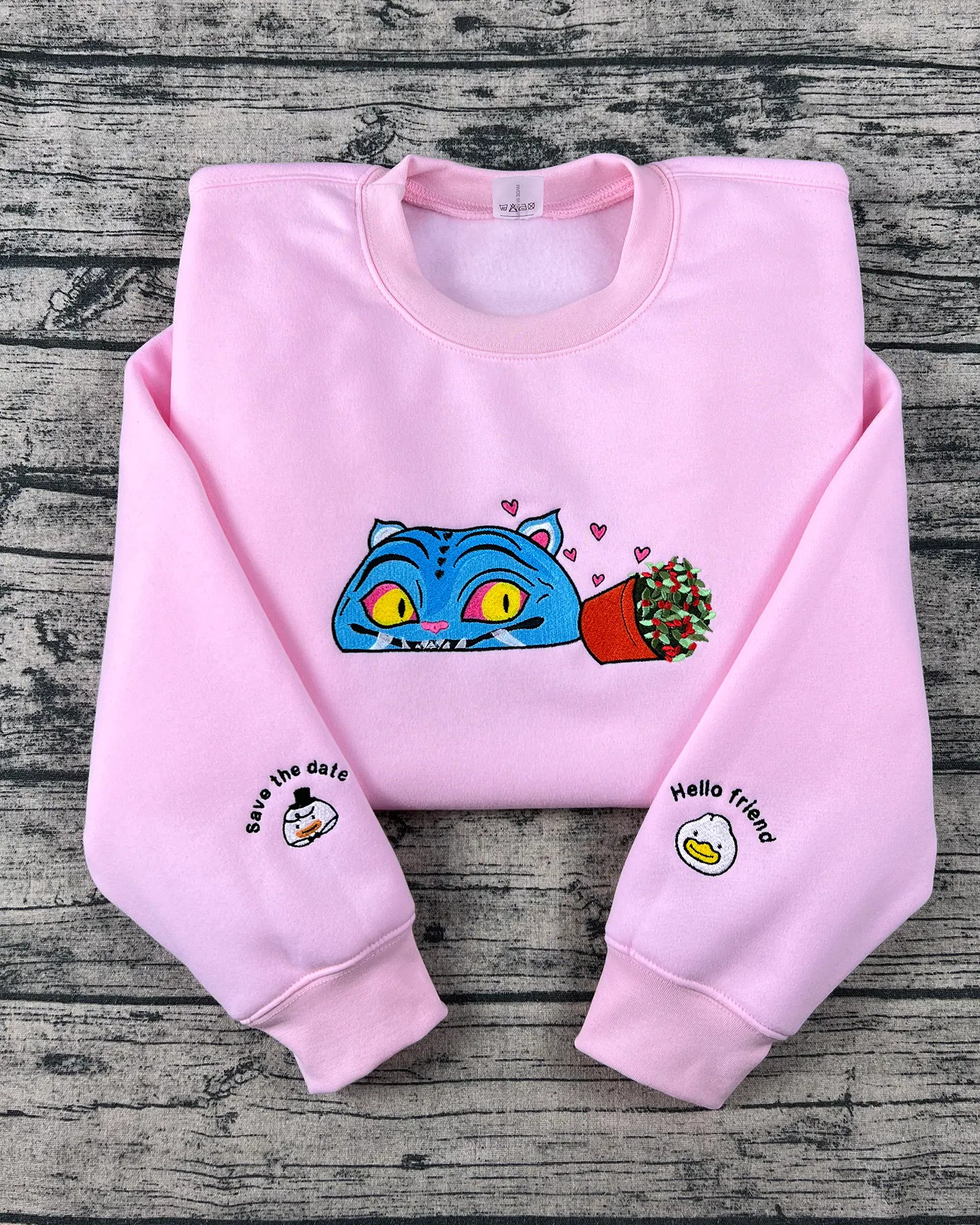 Kpop Hunters tiger embroidered hoodie with derpy demon tiger design. Y2K anime style fan gift for Huntrix and Saja Boys fashion lovers.