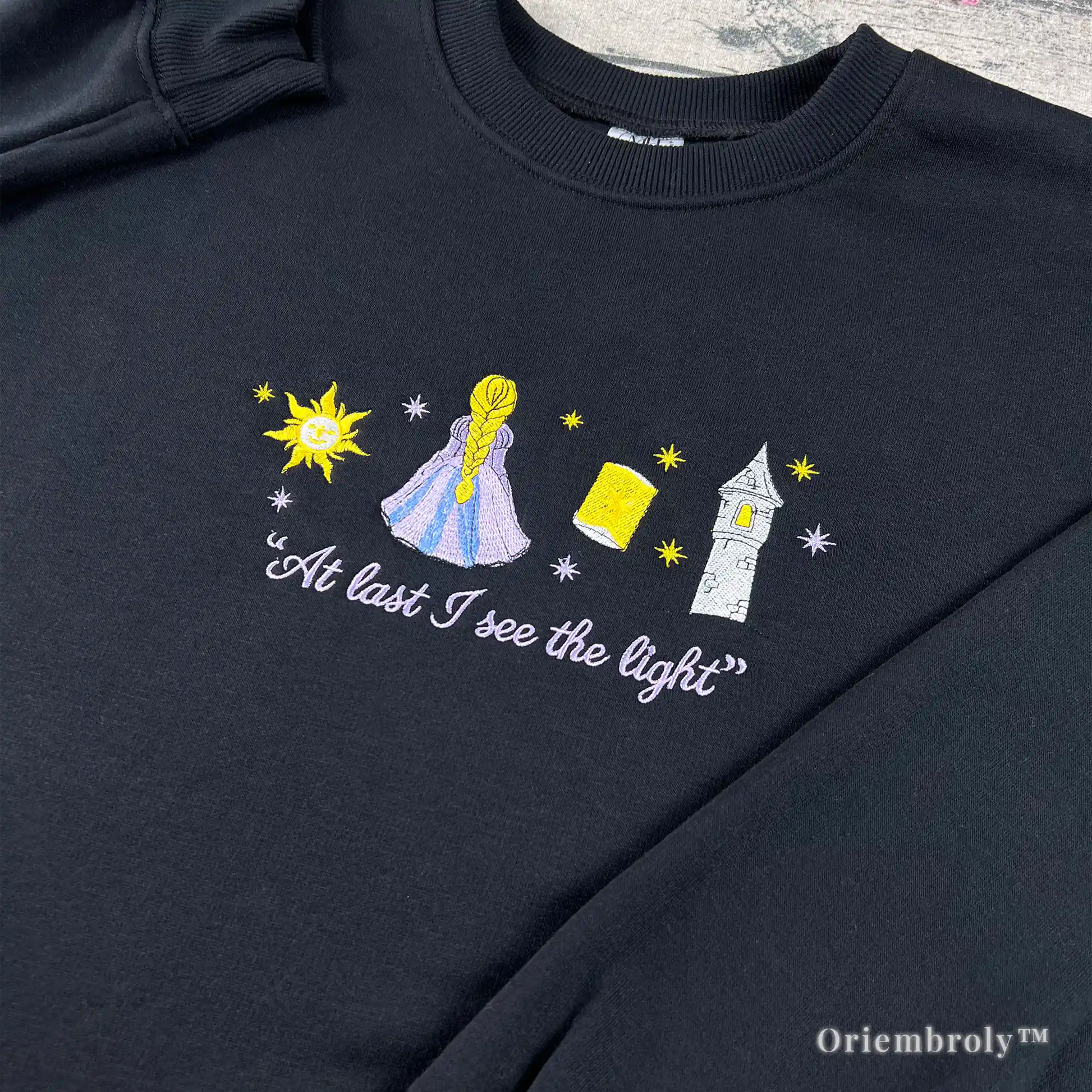 close up embroidery lantern festival inspired design on crewneck
