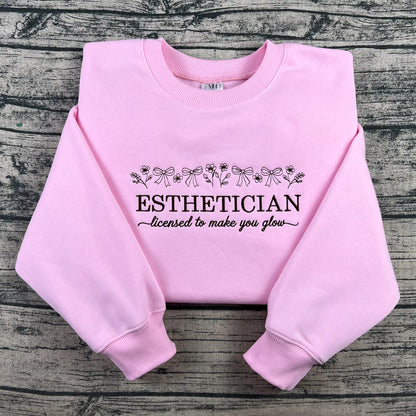 Licensed Esthetician Crewneck Sweatshirt in soft pink with black line-art