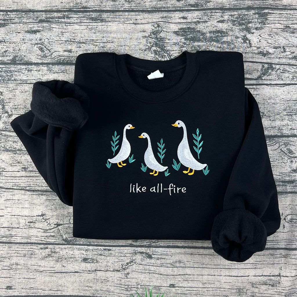 Like All Fire goose embroidered sweatshirt inspired by Hunger Games