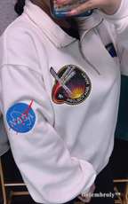 Limited edition space program embroidered pullover featuring the iconic red, white, and blue NASA color palette and official-style mission badges