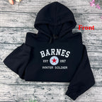 Black hoodie with 'Barnes' and 'Winter Soldier' text on a wooden surface
