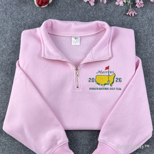 High-quality pink quarter-zip sweatshirt featuring the Masters 2026 Augusta National Golf Club embroidery. A perfect commemorative souvenir for golf fans and tournament visitors