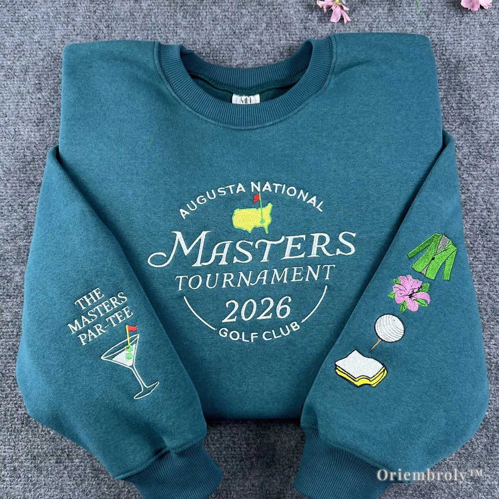 Premium teal crewneck sweatshirt featuring high-quality Masters Tournament 2026 Augusta National embroidery. A must-have souvenir for golf fans and tournament enthusiasts