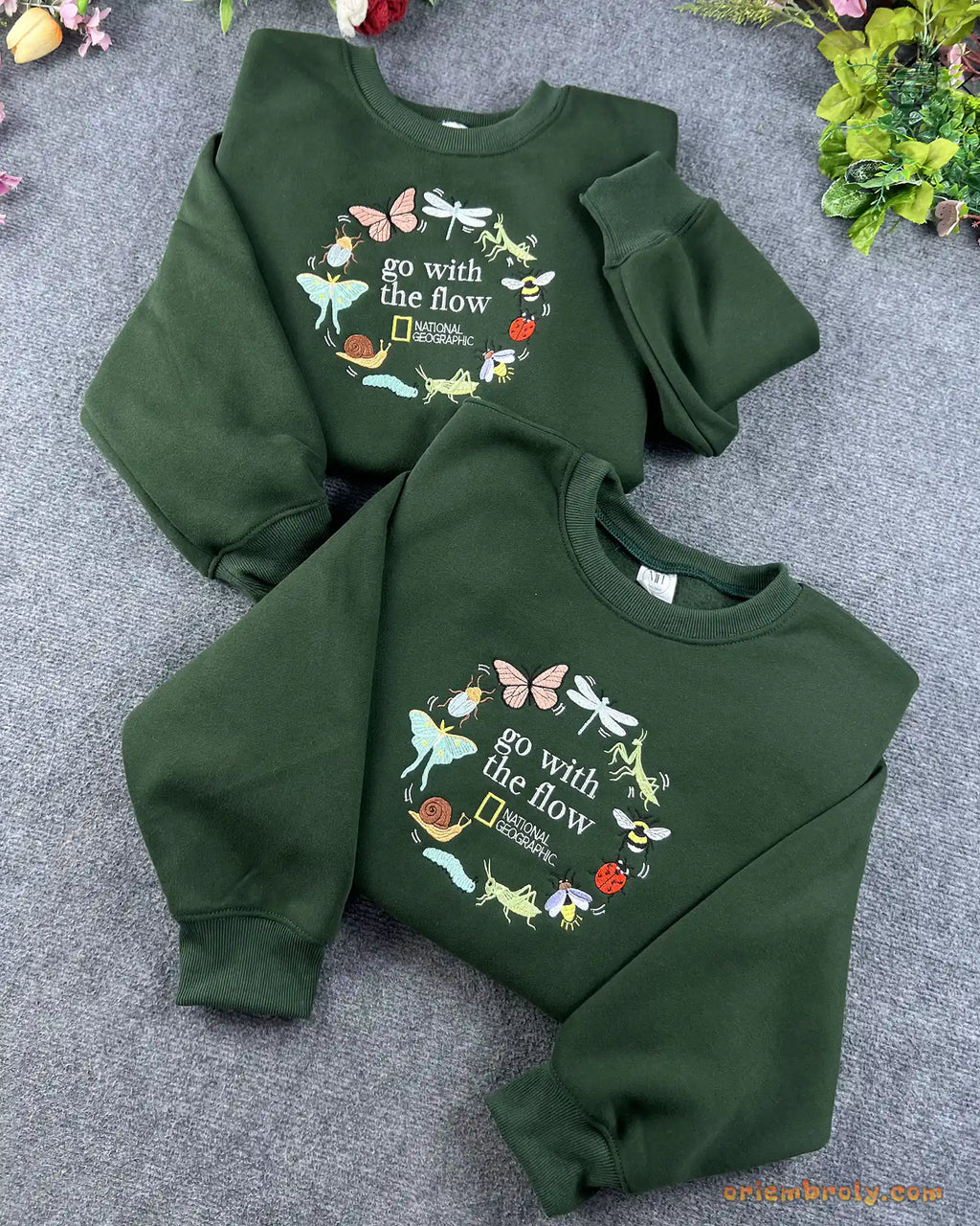 Two forest green Go With The Flow embroidered sweatshirts flat lay for matching couple or best friend gifts
