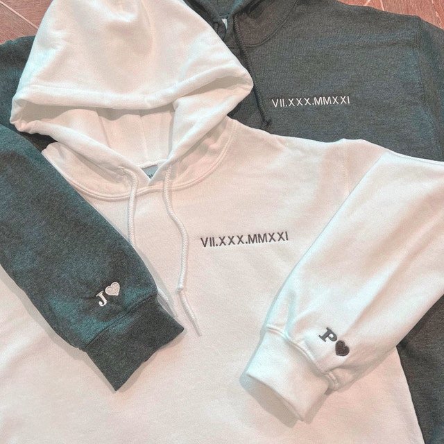 Matching Roman numeral embroidered sweatshirts for couples