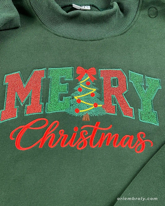Close-up of red and green Merry Christmas embroidery with Christmas tree letter R design on a forest green sweater