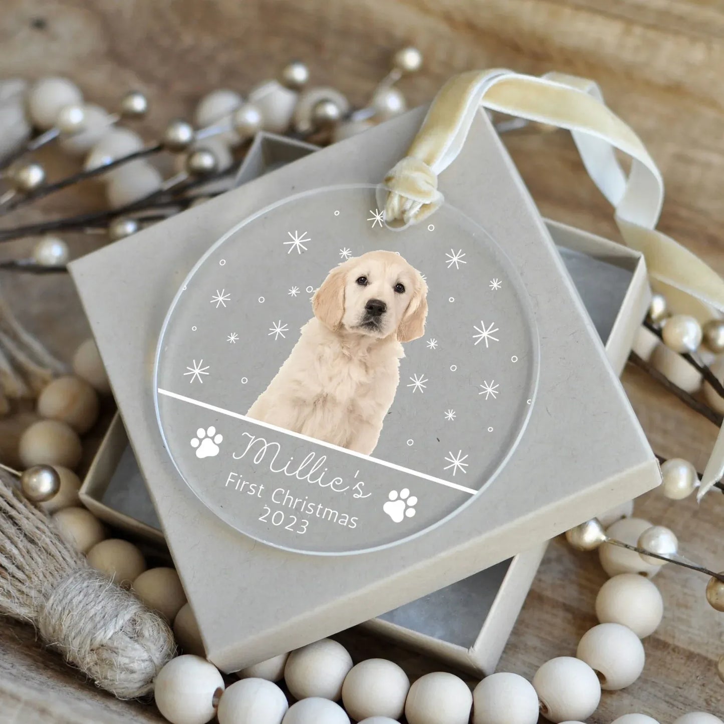 Personalized acrylic Christmas ornament for a dog's first Christmas, featuring a photo of a golden retriever puppy named Millie and the year 2023.