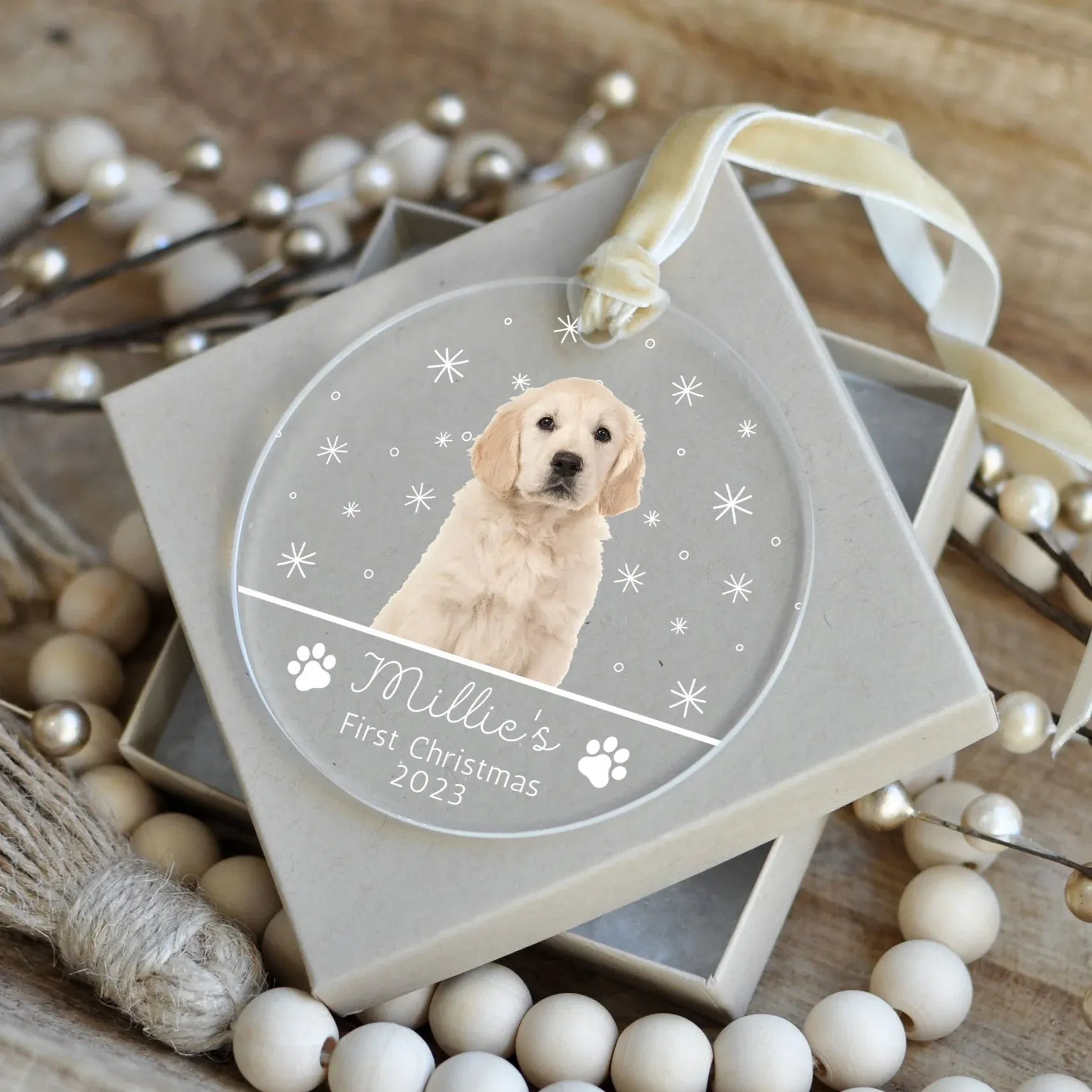 Personalized acrylic Christmas ornament for a dog's first Christmas, featuring a photo of a golden retriever puppy named Millie and the year 2023.
