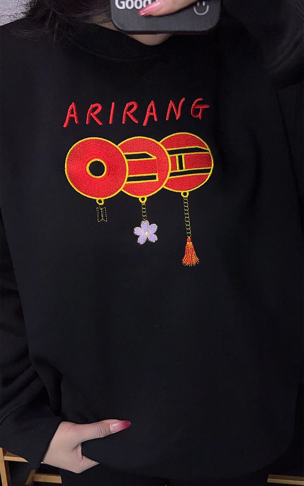 Minimalist BTS ARMY gift: Black embroidered pullover with the classic red three-ring design