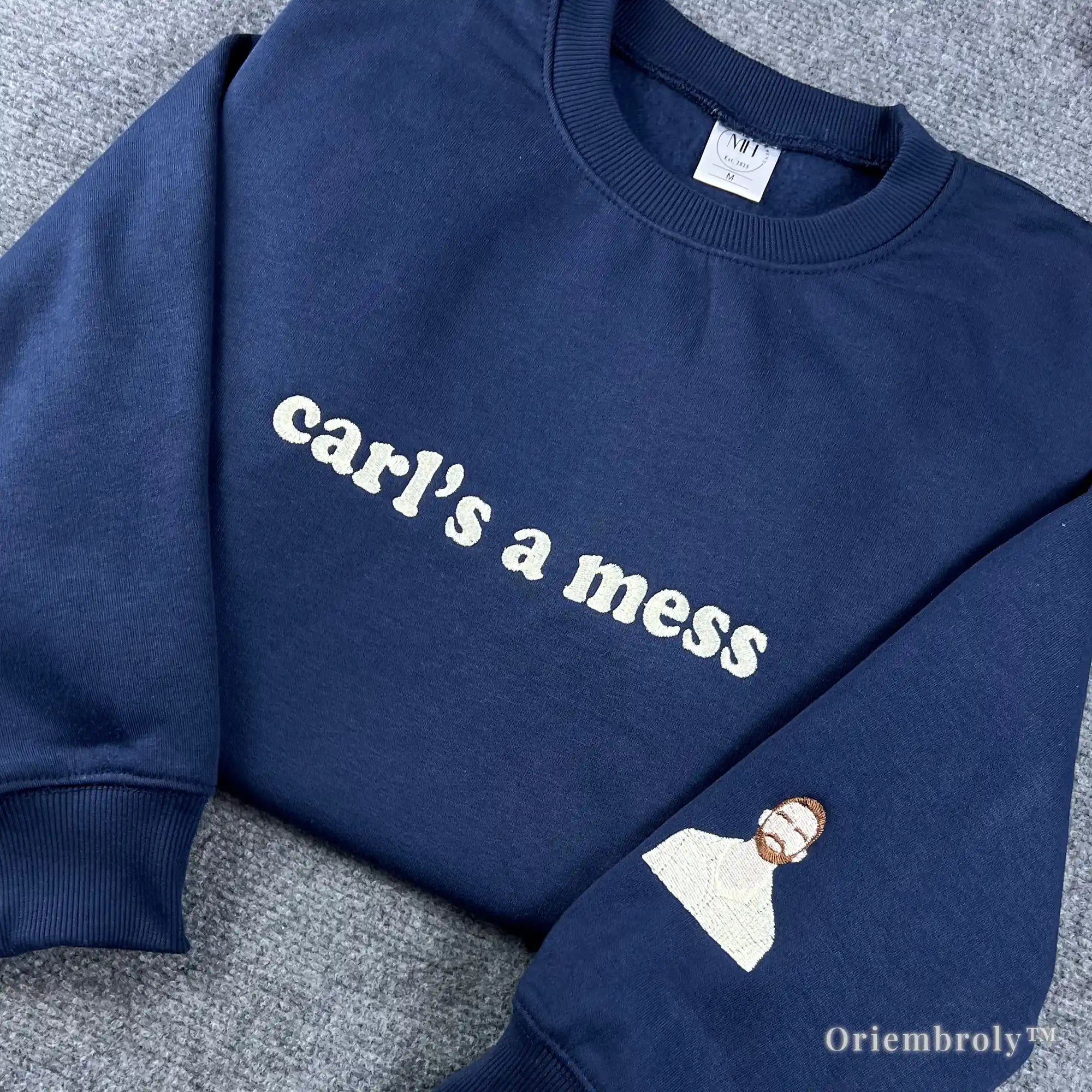 Minimalist streetwear navy sweatshirt with "carl’s a mess" embroidery. Stylish, low-profile design perfect for a clean, aesthetic look. Popular among Gen Z and millennial fashion enthusiasts