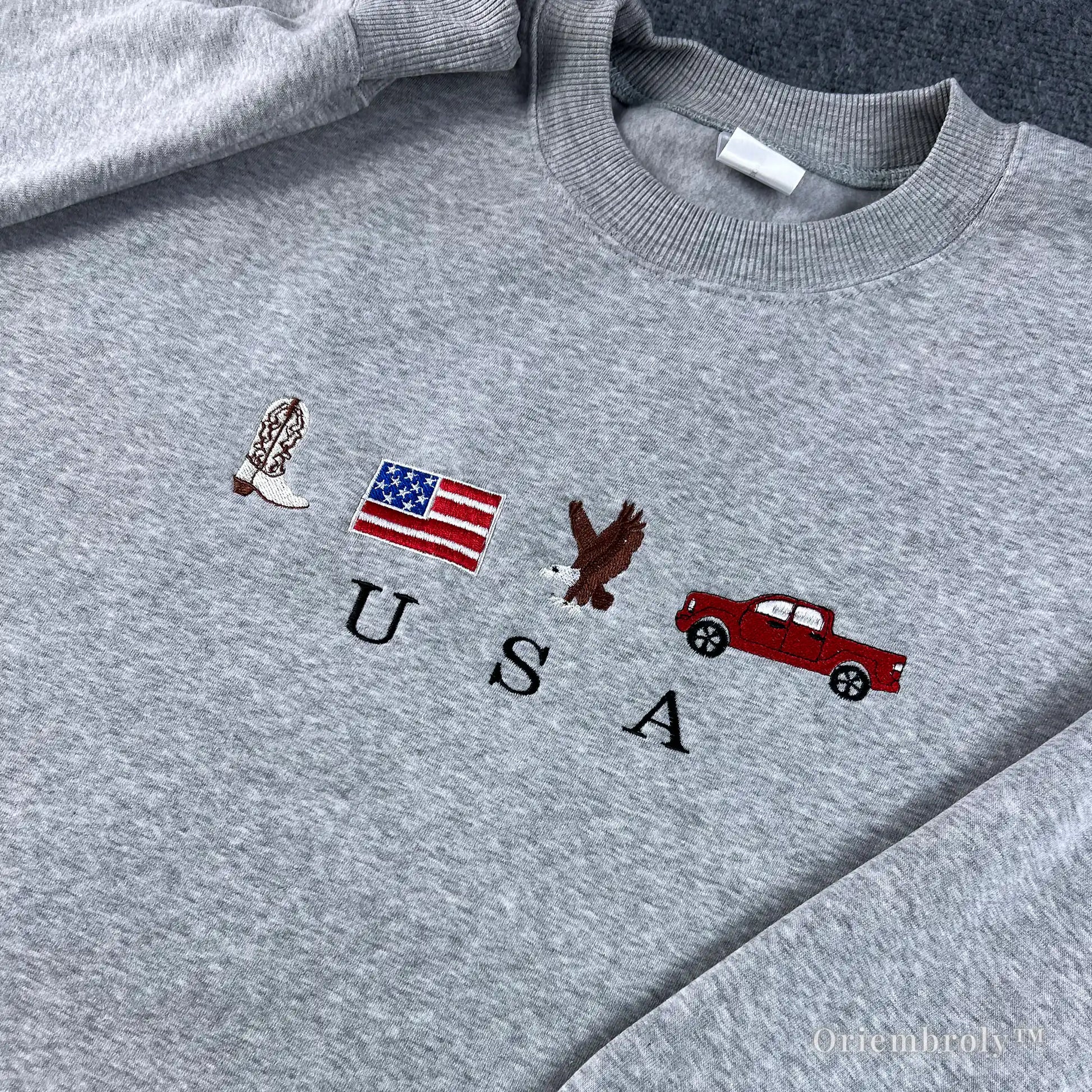 Minimalist USA crewneck sweater in heather grey, featuring patriotic embroidered icons