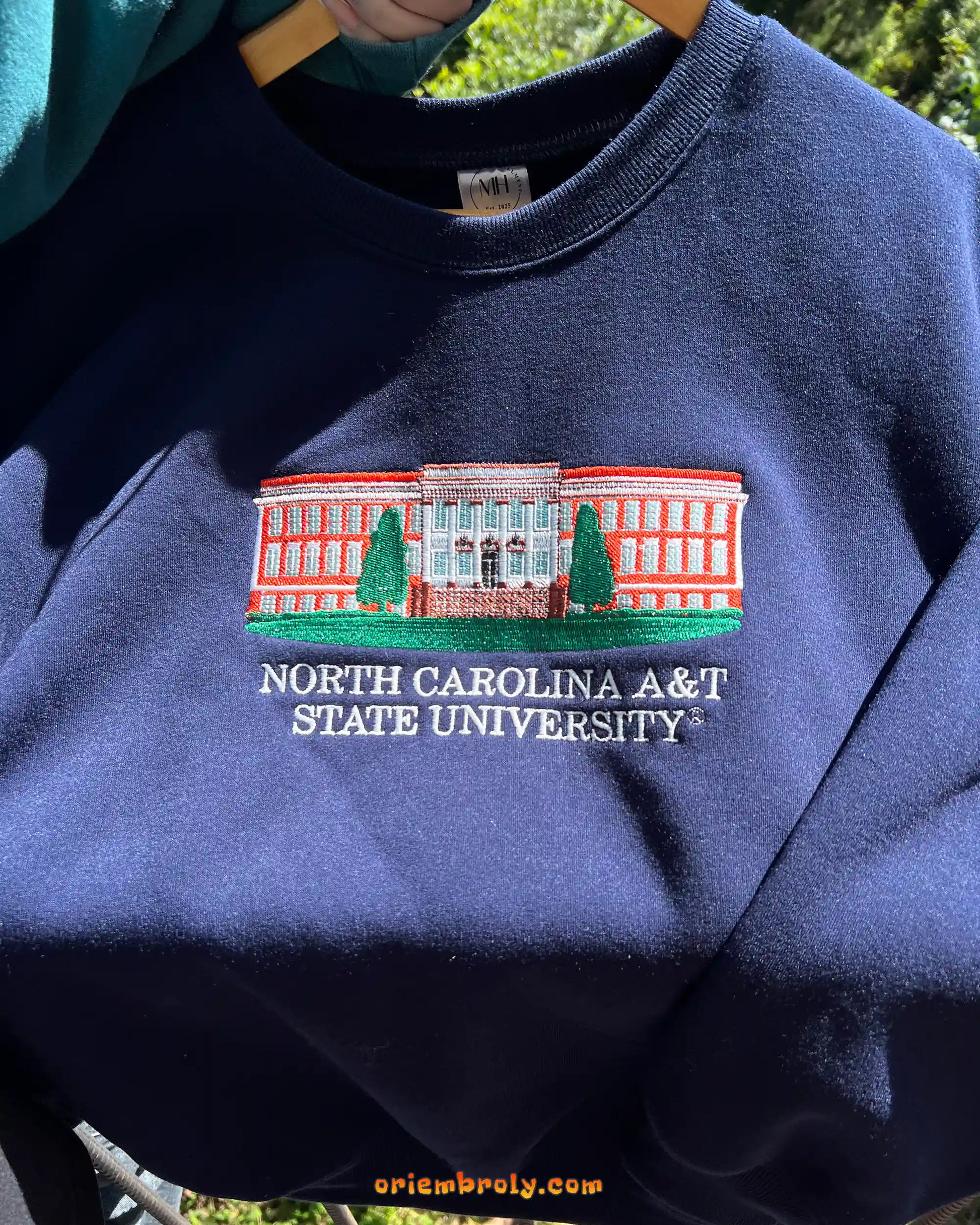 NC A&T campus building embroidered sweater