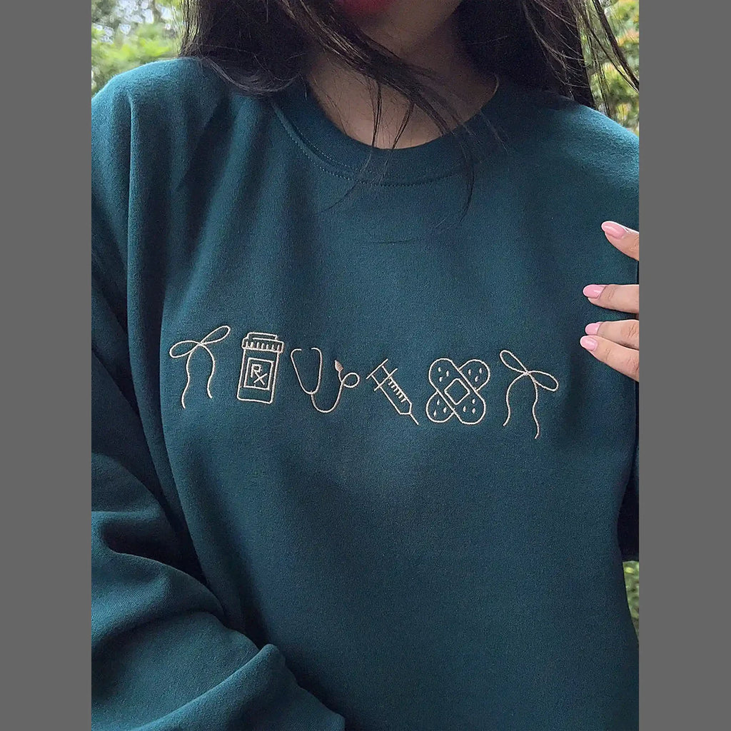 Nurse icon embroidered crewneck front