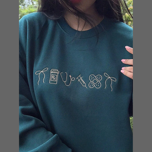 Nurse icon embroidered crewneck front